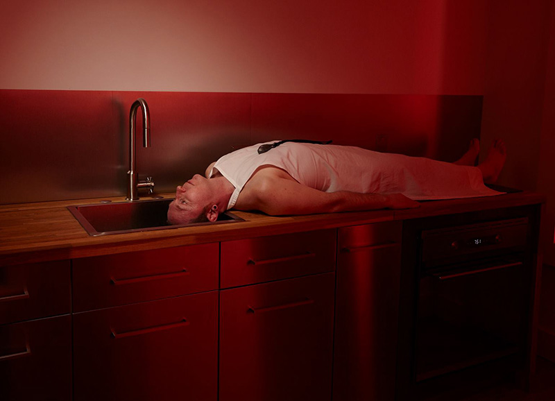 Bored of you, Bored of them, Bored of all. Art show. - photo of man lying on sink